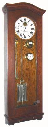 C.1920, Standard Electric Time Co., Springfield, Mass, Master Clock, with original pilot clock, amp-meter, and bell control with tape, plus original 3-jar [sealed] mercury pendulum, from the Prospect Street Elementary School, Dana acquired 1957. This clock hung in Dana's back stairwell, and was the master for 9 slave clocks in the house. Includes the original service record from 1926 through 1996, plus a rating card and additional ephemera. Also has an original Std paper punch for adding a bell ring to the tape. We had sever its main power [dc] when removing this clock. — Antique Clocks Price Guide