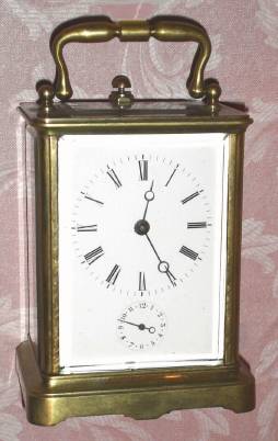 C.1870, Swiss, Brass Cased Carriage Clock, time, strike, repeat and alarm, in a Corniche style case, the strike-work all on the rear plate. — Antique Clocks Price Guide
