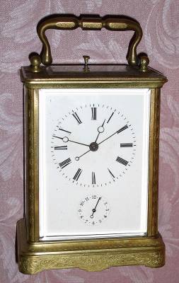 C.1870, Swiss, Brass Cased Carriage Clock, time, strike, repeat and alarm in a finely engraved case [scroll pattern], and with center seconds hand. — Antique Clocks Price Guide