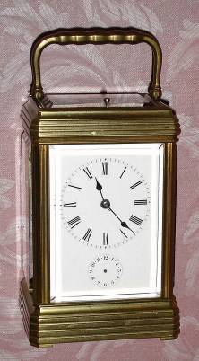 C.1890, French, Brass Cased carriage clock, time, strike, repeat and alarm, in a heavy Cannelee variant ribbed case with full view top. — Antique Clocks Price Guide