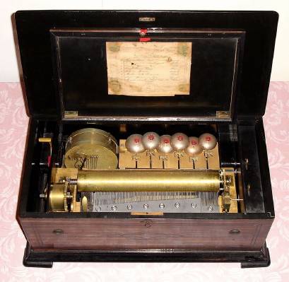 C.1870, Swiss, 8-tune Music Box with snare drum and bells with dove strikers, and original tune sheet. — Antique Clocks Price Guide