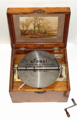 C.1895, Swiss, Mira, Disc playing music box, in an oak case, and with dozen original 9.3" discs. — Antique Clocks Price Guide
