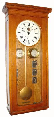 C.1910, E. Howard and Co., Boston, Electric Self Winding master clock [DC] with 2 pilot clocks, bell ringing system [no tape], in a golden oak case. — Antique Clocks Price Guide