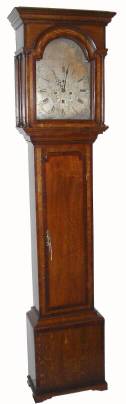 C.1810, English, John Russell, Falkirk,  8-day brass dial tall case, in a slender case of oak veneer with mahogany accents. — Antique Clocks Price Guide