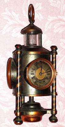 C.1890, French, "Davy Lamp",, from the industrial series, clock case in the form of a lantern, with 3 sides, with a barometer in one, thermometer in the second and timepiece in the third, compass at top. — Antique Clocks Price Guide