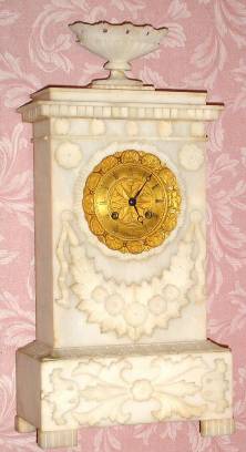 C.1850, French, Empire style case of carved alabaster, 8-day bell strike silk thread movement. — Antique Clocks Price Guide