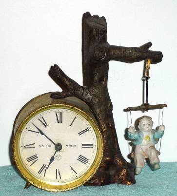 C.1895, Ansonia Clock Co., SWING No. 2, with old but not original doll. — Antique Clocks Price Guide