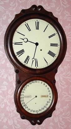 C.1865, Seth Thomas Clock Co., "Office Calendar No. 4", double dial perpetual calendar, wall timepiece, 8-day, in rosewood. An 1863 catalog litho of this model shows it with plain dials and the earlier moon hands as found on this example. — Antique Clocks Price Guide