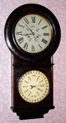 C.1875, Welch, Spring and Co., Bristol, Conn, 2-Wt Lewis Calendar, similar to the No. 2 model, but with 10 inch calendar dial, 3 ft case length and uncommon 2-wt Welch design movement, rosewood veneer. — Antique Clocks Price Guide