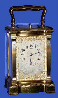 C.1900, French, Brass Cased Carriage clock, time, strike and repeat, in a Doucine variant case, and with hand painted ivory panels and dial mask, dial signed Tiffany and Co. See this same case style in A Century of Fine Carriage Clocks, Fanelli and Terwilliger [1987), clock No. 1 (page 15). — Antique Clocks Price Guide