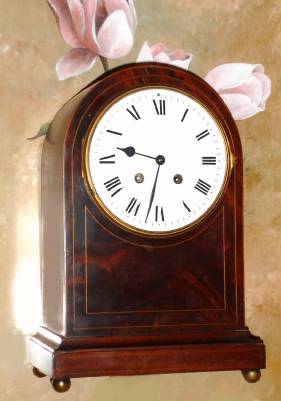 C.1900, French, 8-day time and strike mantel clock, round Gothic styled mahogany case. — Antique Clocks Price Guide