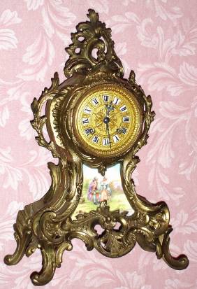 C.1910, French, Japy Freres, 8-day time and strike white metal rococo style case with a hand painted porcelain insert, showing a man courting a lady. — Antique Clocks Price Guide