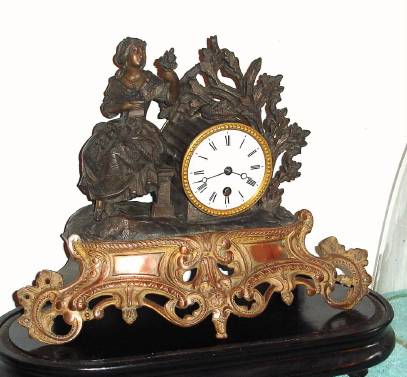 C.1890, French, 8-day figural white metal mantel timepiece under a dome, flower girl. — Antique Clocks Price Guide
