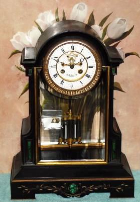 C.1895, French, Marti and Cie, 8-day time and bell strike, black marble clock, with malachite inserts retailed by D. H. Buell and Co., Hartford (on dial, with open escapement), and with 2 vial compensating pendulum. — Antique Clocks Price Guide