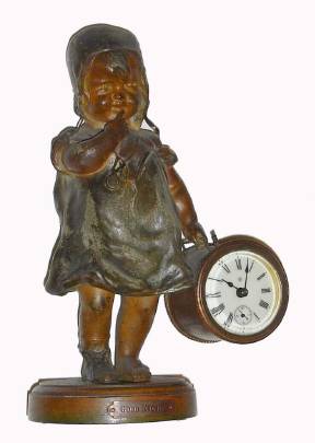 C.1885, Ansonia Clock Co "Good Night" novelty clock, patinated spelter statue of a young girl in her nighty, carrying a drum in her left hand, that contains the clock, the base with plaque that reads "Good Night". — Antique Clocks Price Guide