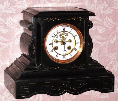 C.1900, French, Marti and Cie, 8-day time/strike black marble mantel clock, with open escapement on the dial. — Antique Clocks Price Guide