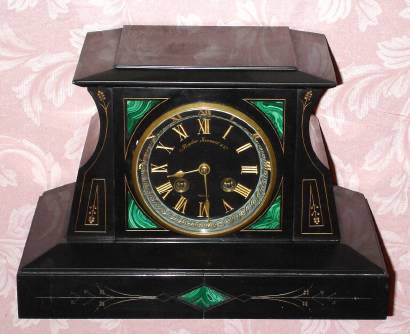 C.1900, French, Japy Freres,  8-day time and bell strike black marble with malachite inserts that was retailed by Bigelow, Kennard and Co., Boston. — Antique Clocks Price Guide