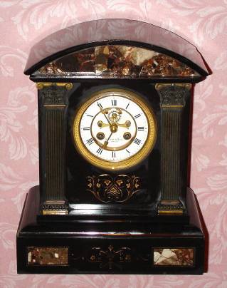 C.1900, French, Marti et Cie, 8-day time/strike black marble with contrasting marble inserts mantel clock that was retailed by Bartens and Rice, New York. — Antique Clocks Price Guide