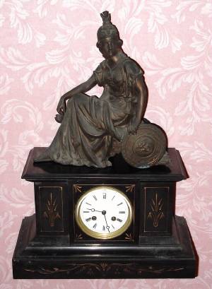 C.1900, French, Japy Freres, 8-day time and strike black marble with an added figure mantel clock. — Antique Clocks Price Guide