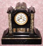 C.1900, French, Saumel Marti, Black Slate clock with open escapement on the dial, 8-day, gong striking. — Antique Clocks Price Guide