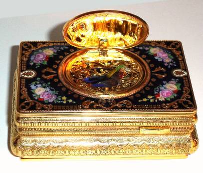 Late 20th Century, Singing Bird Box, the dore case decorated with cobalt blue enamel with pink floral accents in the corners, — Antique Clocks Price Guide