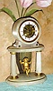 C.1890, French, Swinging Doll Timepiece, with skeletonized front plate showing the wheels of the movement. 