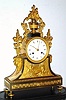 C.1820, French, Ormolu Clock with original dome and base, case depicts a goddess receiving grapes from a cherub, and swags of grape vine with clusters of grapes, all "growing" out of an urn at top.. 
