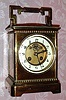 C.1900, French, Brass Cased carriage timepiece, oversize [10.25"], with exposed and cut out platform lever on the dial center, and with circular thermometer and compass in the top of the clock. 