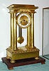 C.1850, French, time and bell strike 4-pillar empire style, gilt brass case with knife edge suspension, mantel clock, 8-day, with cover. 