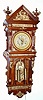 C.1890, Ansonia Clock Co "ANTIQUE HANGING", in an oak case with profuse gilt bronze trim, 2-weight, 8-day. 