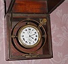 C.1911, Elgin National Watch Co., 18S , 21j, deck watch with 40-hour up down indicator in a gimbaled mahogany Elgin box. 21-jeweled movement adjusted for 3 positions with the serial no. 16,748,608. This model was made only for 2 years, succeeded by "Father Time" models.