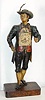 C.1880, German, Clock Peddler, and clock, made of painted tin on a rectangular wood base.. 
