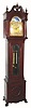 C.1915, Seth Thomas Clock Co, 8-day, 2-wt striking longcase clock with brass dial and rolling moon, mahogany case with chamfered corners, fancy side frets and removable hood. 