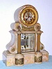 C.1880, French, for J. E. Caldwell and Co, Philada, tan onyx mantel clock with open escapement on the onyx dial center, and with 2 vial compensating pendulum. 