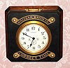 C.1930, Waltham Watch Co., "Waltham Chronometer" model, 8-day back wind with up/down indicator on the dial, mounted in a mahogany case with a black marble top with the company name and "Correct Time" in brass fastened on top. Counter top advertising piece for the retailer.