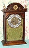 C.1790, French, 8-Day, Shelf clock with silk thread suspension and short span tic-tac escapement, unsigned.  Cast brass dial with image of a queen, and 12 individual cartouche numerals. 
