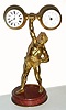 C.1895, French, Commemorative of EUGENE SANDOR, famous weight lifter who performed at the World Columbian Exposition in 1893, gilt bronze on a marble base, small 8-day platform style timepiece in left ball. 