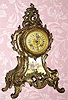 C.1910, French, Japy Freres, 8-day time and strike white metal rococo style case with a hand painted porcelain insert, showing a man courting a lady. 