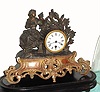 C.1890, French, 8-day figural white metal mantel timepiece under a dome, flower girl. 