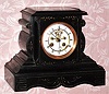 C.1900, French, Marti and Cie, 8-day time/strike black marble mantel clock, with open escapement on the dial. 