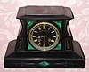 C.1900, French, Japy Freres,  8-day time and bell strike black marble with malachite inserts that was retailed by Bigelow, Kennard and Co., Boston. 
