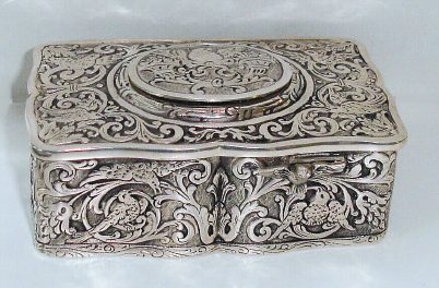 Late 20th Century, German, Singing Bird Box, in a tooled sterling silver case [marked .925 on base], key wound from bottom. — Antique Clocks Price Guide