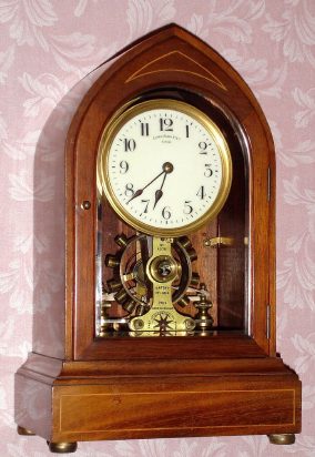 C.1910, English, EUREKA CLOCK CO, Ltd, London, battery powered mantel clock in mahogany, with satinwood line inlay, serial No. 9078. — Antique Clocks Price Guide
