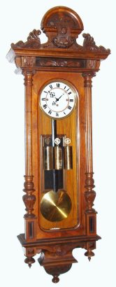C.1875, Austrian, 3-Wt Grand Sonnerie, Vienna Regulator, in an Alt Deutsch style wall case with original carved top. — Antique Clocks Price Guide