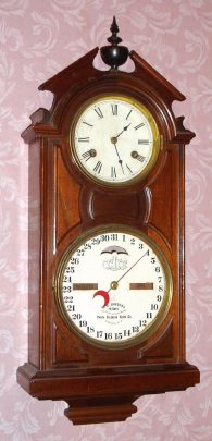 C.1875, Ithaca Calendar Clock Co., No. 6 Hanging Library, double dial perpetual calendar, 30 day double spring time. — Antique Clocks Price Guide