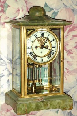 C.1914, Ansonia Clock Co., CHANCELLOR, 4-glass crystal regulator with green onyx top and bottom, 8-day gong strike movement with open escapement on dial. — Antique Clocks Price Guide