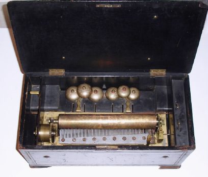 C.1875, Swiss, 8-tune, Bells in sight music box in need of restoration, 80 teeth in main comb, 6 in bell comb, cylinder is 13 inches — Antique Clocks Price Guide