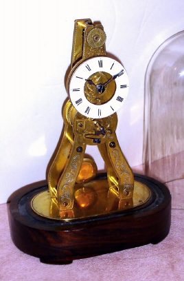 C.1851, French, Pierret, Mini  Skeleton timepiece with engraved front plate and porcelain dial, base marked Ms.Honorables, Exp. Paris, Londres, and the back plate with the initial "P". — Antique Clocks Price Guide