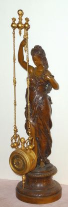 C.1885, French, Mysterious Timepiece, the clock suspended from two parallel chains, mov't with a form of Brocot escapement, moves from side to side with no apparent impulse. — Antique Clocks Price Guide