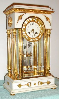 C.1895, France, S. Marti, White Marble and Ormolu 4-glass "Crystal Regulator", with the 12 Zodiac signs surrounding the porcelain dial, cast lions on each side of the case, and with 2-vial compensating pendulum intact. — Antique Clocks Price Guide